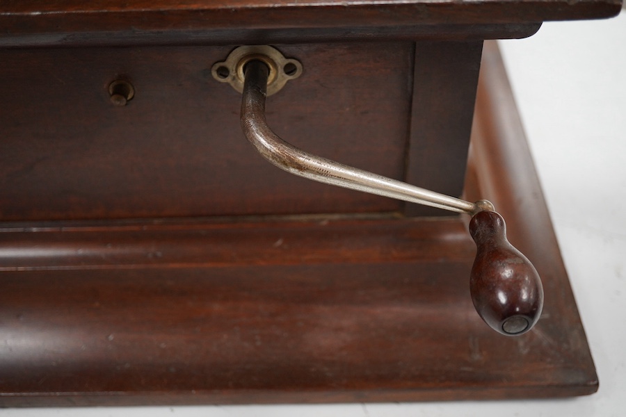 An HMV tabletop mahogany gramophone player with large laminated wooden horn, diameter of horn 55cm. HMV transfer labels to both body and horn. Condition - fair.